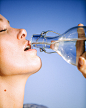 woman-drinking-water-from-glass-bottle-3124674