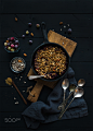 Healthy breakfast. Oat granola crumble with frozen fresh berries, and seeds in irom skillet pan on r by Anna Ivanova on 500px