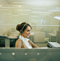 商务,通讯,构图,图像,摄影_200265920-001_Woman using headset in office, smiling, side view_创意图片_Getty Images China