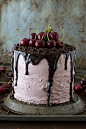 A 3 layer white cake filled with chopped cherries and cherry buttercream. Topped with a drizzled chocolate ganache and fresh cherries!