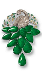Jadeite, Gemstone and Diamond 'Peacock' Brooch Modelled as a peacock pavé-set with circular-cut green and brown sapphires, yellow diamond and rubies together weighing approximately 2.05 carats, the plumage set with thirteen translucent jadeite plaques of
