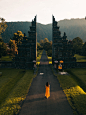 Free Back View of a Woman Walking Towards the Famous Bali Handara Gate Stock Photo