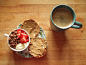 coconut dessert tofu topped with strawberries and coco sweets cereal, whole wheat english muffin with almond butter, and coffee