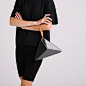 Small Convertible Flex Bag - Black & Gray : Our architectural, origami inspired shoulder bag, now has a new dimension. It can be converted into a wrist bag just with a quick move. The shoulder strap can easily be removed, so you can slung it from your