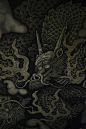 black and beige dragon-printed textile