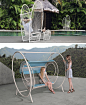 12 Outdoor Furniture Designs That Add A Sculptural Element To Your Backyard // Nylon cords wrapped around a powder-coated steel frame give the PAPILLON chair a unique look and provide ultimate comfort.