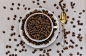 Cup and saucer filled with coffee beans and spoon by Alexander Melnikov on 500px