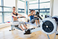 Woman sitting at the row machine smiling