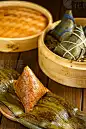 duanwu festival rice dumplings zongzi and bamboo steamer on wooden tableduanwu festival rice dumplings zongzi and bamboo steamer on wooden table