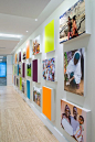 A thirty-foot wall filled with large vibrant photographs highlights the décor and international work of Futures Group. Image courtesy of BBGM.