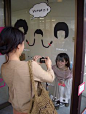 funny idea for a party: draw some haircut on a window so that your guests can take funny pics.