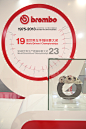 BREMBO, Autoshow Beijing : The Brembo stand has been thought as a box that opens itself on the audience on the two sides. All the components have been designed with order and homogeneity, to reflect the fluency of the Brand approach to the way of thinking
