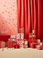 Gifts with red boxes and gold foil on a shelf, in the style of scattered composition, luminous hues, monochromatic abstractions, polka dot madness, light red, tabletop photography, stripes and shapes