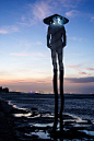 Oystermen: Towering Metallic Sculptures by Marco Casagrande : "Oystermen" is an environmental artwork located at a tidal beach in Kinmen Island, Taiwan. The sculptural installation created by Finnish architect Marco Casagrande features four stai
