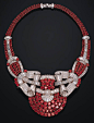 A FINE RUBY AND DIAMOND NECKLACE The front designed as four rows of rubies to twin baguette and circular-cut diamond scrolls to the ruby and diamond shoulders and twin-row backchain, mounted in platinum and 18k gold, 41.5 cm.