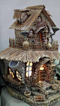 This may contain: a small house made out of wood and stone