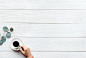 Person Holding White Ceramic Teacup With Black Coffee