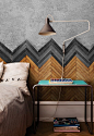 incredible wall treatment or headboard using flooring in a chevron pattern: