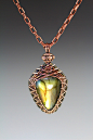 This is a hand woven bezel in copper wire with a beautiful Labradorite cab.  Lisa Barth