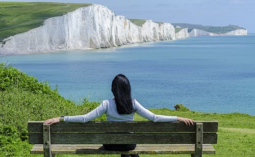 Woman Sitting on Dec...