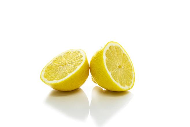 2 yellow lemon on wh...