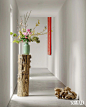 Photo by AD China on April 11, 2024. May be an image of vase, flower arrangement, carnation, hallway and text.