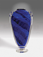 Midnight Blue Shoulder Vase by Mark Rosenbaum (Art Glass Vase) | Artful Home : Midnight Blue Shoulder Vase by Mark Rosenbaum. This blown glass vase is created using manipulated layers of colored glass encased between layers of glass crystal. Hot glass add