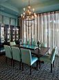 Beach-blue walls, sea glass-inspired accessories and aqua upholstered dining chairs give this dining room from HGTV Smart Home 2013 a casual elegance.