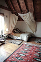 Curtains over bed. 