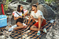 Young couple having picnic at riverside in sunny day Free Photo