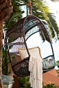 Give your mother the day off and let her relax in her new outdoor Swingasan®, featuring an airy, open-weave back, side compartments for her drink and a canopy that provides cool shade—all in weather-proof synthetic rattan that's been woven by hand over a 