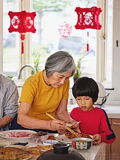 Chinese Multi-Generation Family Preparing New Year Food in a KitchenA chinese multi-generation family preparing food to celebrate Chinese New Year in a home in Taipei, Taiwan.