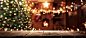 暖炉の近くのイルミネーションを持つクリスマスツリー。家の装飾 - christmas wooden tabletop ストックフォトと画像