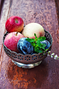 apples and plums in iron vase by Mykola Lunov on 500px