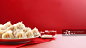 【AI数字艺术】红色背景上的一盆饺子图片素材