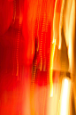 This may contain: blurry photograph of red and yellow lights