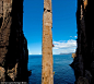 Group effort: Two climbers make their way up the 213ft high Totem Pole