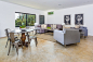 Example of a large trendy open concept concrete floor and brown floor game room design in San Francisco with white walls, no fireplace and no tv