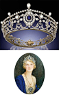 THE PORTLAND ANTIUE SAPPHIRE, DIAMOND AND NATURAL PEARL TIARA. Designed as a series of twelve graduated cushion-shaped sapphire and old-cut diamond clusters to the openwork frame of diamond-set swag and husk motifs, embellished with bouton-shaped pearls @