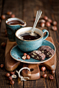 The blue of the cup and saucer, the mocha brown of the table and the beans, the COFFEE and the biscuits. It's almost too close to heaven.