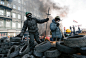 Protesters stand on a barricade during an anti-government protest in downtown Kiev, Ukraine, Jan 24. 