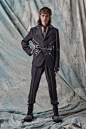Image may contain Suit Clothing Formal Wear Coat Tuxedo Adult Person Jacket Tie Accessories Footwear and Shoe