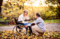 Senior couple in wheelchair in autumn nature. by Jozef Polc on 500px