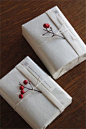 White wrapping with little red berries.