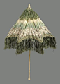 Taffeta, ombré green to cream with chiné design of leaf serpentine in brown and cream, trimmed with green silk fringe; lined with white china silk; straight, folding, carved ivory handle with ball end; turned ivory tip with ring; a few cracks in the taffe