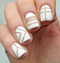 Less is more! We're all about the minimalist negative space nail art. Love the graphic white here.: 