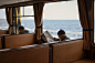 Man Sitting on Chair Reading Newspaper