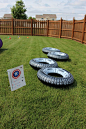 Superhero Training Center - Superhero Obstacle Course - Captain America Tire Run-Inflatable Tires from the Dollar Tree Store. Sign holder from Meijer in the garage sale sign section.: 