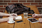 工作，办公-Friends sitting in cafe writing in notebook with digital tablet and c ...