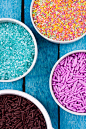 sugar sprinkles : Sugar sprinkles for cake decoration on a wooden background